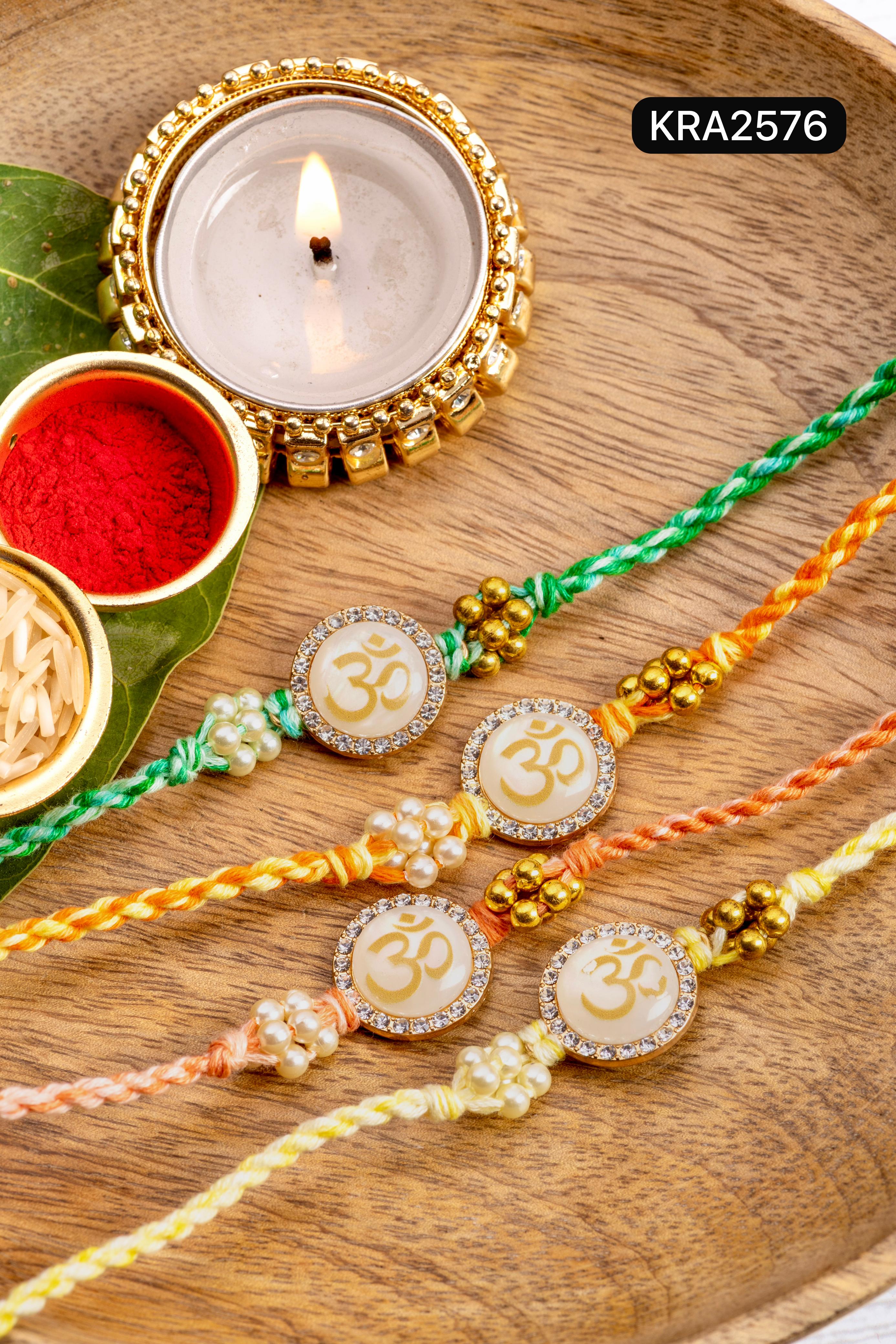 Monalisa Stone OM Embellished Hand Braided Rakhi With Tassels (KRA2576)