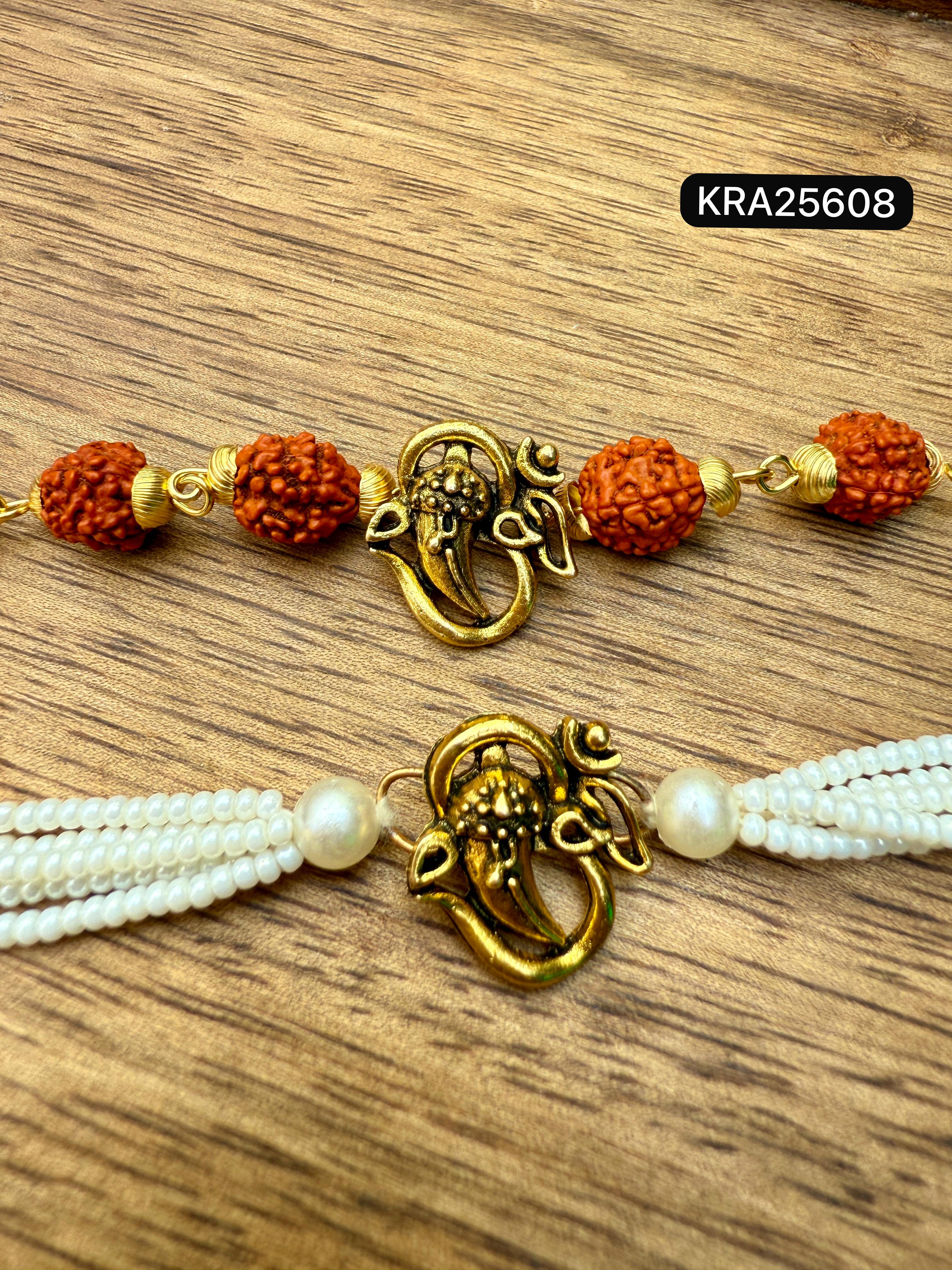 OM With Ganesh Ji Metal Broach Rudraksha Bracelet With Pearls Bracelet Set (KRA25608)