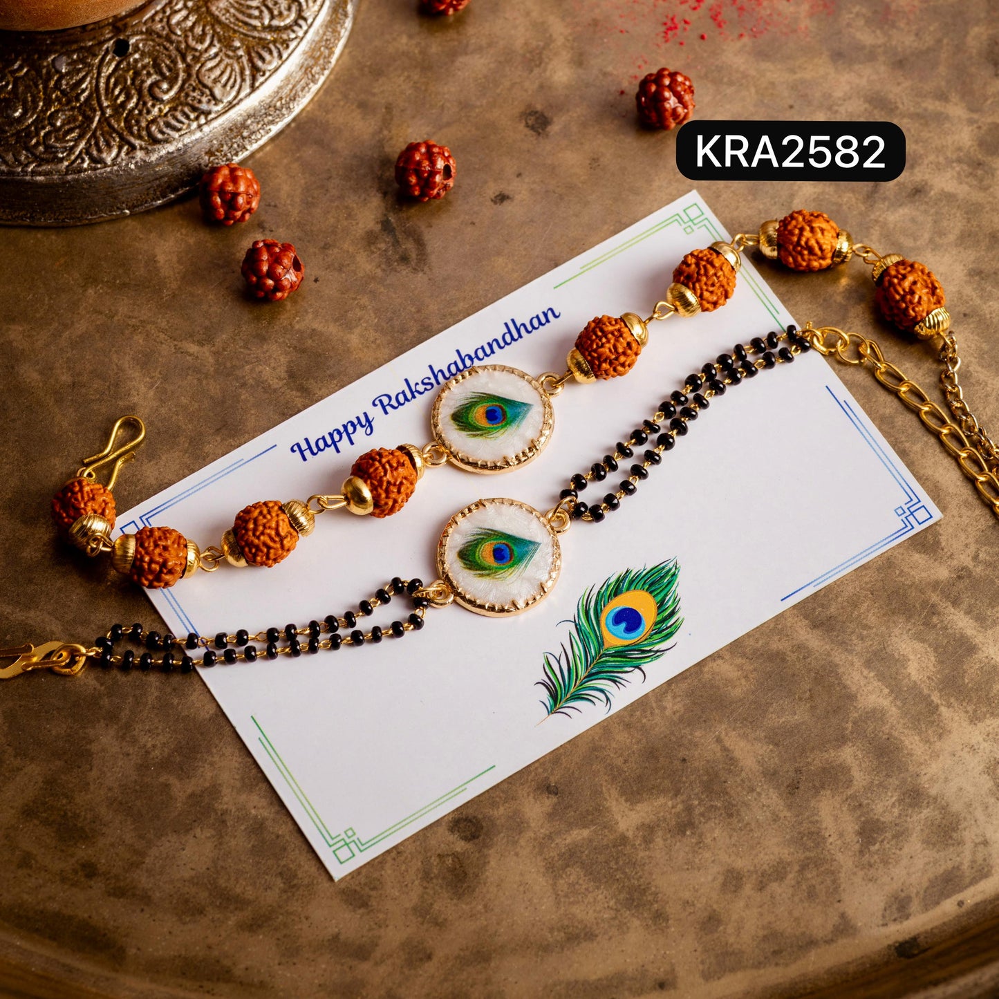 Mother Of Pearl Morpankh Rudraksha Bracelet For Bhai With Black Beads Bracelet For Bhabhi (KRA2582)