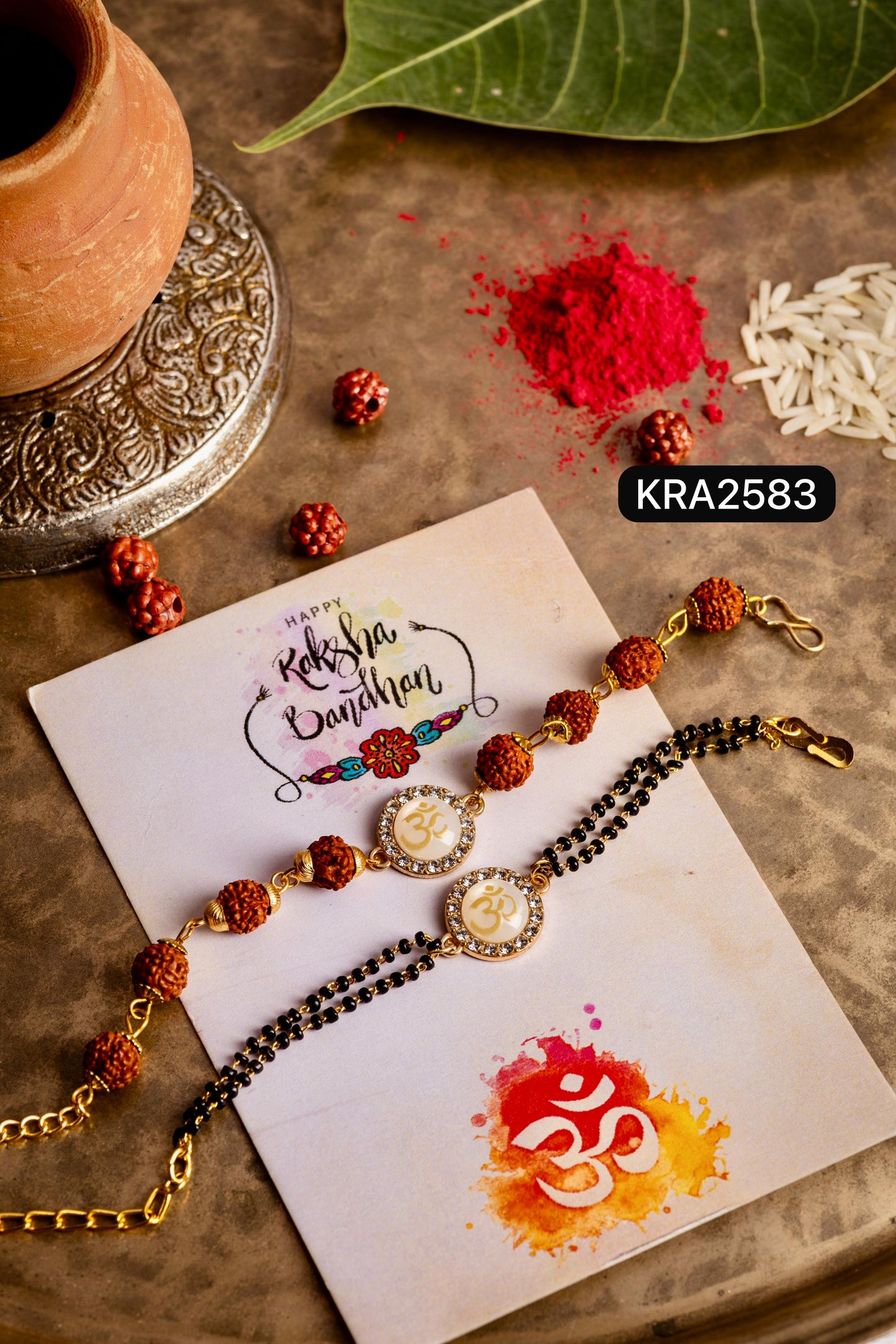 Monalisa AD Studded OM Rudraksha Bracelet For Bhai With Black Beads/Golden Bracelet For Bhabhi (KRA2583)